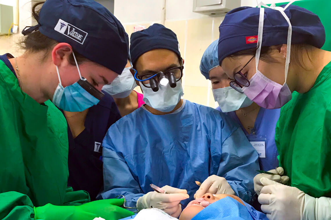 Medical staff working on patient in operating room